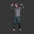 A Man In Gray Hoodie Green Pants White Sneakers Flexing Arms Showing Muscles