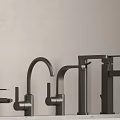Sleek Black Faucets With Different Shapes And Modern Designs On Countertop