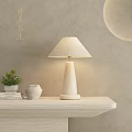 Minimalist Textured Base Table Lamp with Beige Fabric Shade on Shelf and Potted Plant