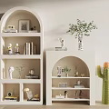 Stylish White Arched Decorative Cabinets With Books Decorations Green Plants And Cactus