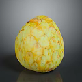 Yellow Textured Sugar Apple Fruit on Gray Reflective Background Surface