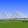 Modern Arch Bridge Design Over Blue Water With Green Grass And Roadway