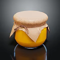 Ceramic Jar With Yellow Preserve And Cloth Lid Tied On Black Background