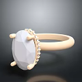 Elegant Ring With Oval White Gemstone And Small Diamond Accents On Golden Band
