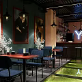 Young Blood Cafe Interior With Art Paintings Pendant Lights Blue Chairs And Green Floor Decor
