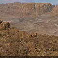 Rugged Desert Scenery With Golden Rock Formations And Sunset Illuminated Valleys