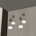 Modern Chandeliers With Hanging Metal Spheres And White Shades In Interior Design