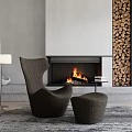 Modern Brown Woven Single Sofa Living Room Interior With Fireplace Ottoman Floor Lamp And Rug