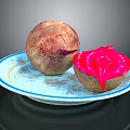 Fresh Whole And Cut Beetroot With Vibrant Red Flesh On A Plate