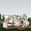 Two Modern Tents With Triangular Roof Design In Grass Field And Outdoor Seating