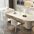 Modern Kitchen Interior With White Marble Island Counter And White Dining Chairs