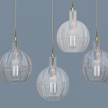Four Transparent Spherical Textured Pendant Lights Hanging On Blue Wall