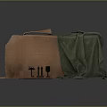Open Corrugated Cardboard Box With Red Cloth Inside And Green Cloth Beside