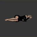 Woman Lying On Smooth Surface Wearing Black Outfit With Short Hair