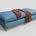 Modern Blue Upholstered Ottoman With Brown Throw Blanket And Gold Metal Legs