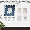 Abstract Painting As Focal Point On Brown Wall With Artworks Chandelier Plant And Wooden Floor