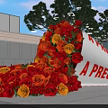Scattered Red Yellow Roses With Tilted White Scroll Showing A Precious Gift Near Modern Building