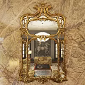 Elegant Ornate Golden Frame Mirror Reflecting Living Room With Sofa Chandelier And Marble Wall