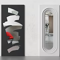 Modern Decorative Mirrors With Black Irregular And White Oval Frames Reflecting Red Chair And Vase