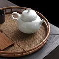 White Ceramic Teapot On Bamboo Tray With Wooden Tea Accessories