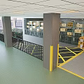 Spacious Warehouse Interior With Forklift Rows Of Storage Racks And Checkerboard Floor