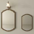 Large and Small Decorative Mirrors with Ornate Frames and Wall Sconce for Home Decor
