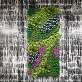 Lush Green Plant Wall With Various Green Plants And Purple Flowers Against Textured Wall