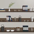 Elegant Tea Sets Display On Shelves With Books Vase Plant Teapots And Cups