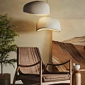 Wooden Leisure Chair In Cozy Living Room With Green Plant Pendant Lights And Decorative Painting