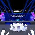 Elegant Banquet Hall With Blue Lighting Stage Logo Round Tables White Tablecloths And Chairs
