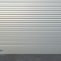Three Colored Garage Doors With Brick Wall And Blue Sky Background