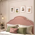 Photo Wall With Framed Photos Above Pink Headboard In Cozy Bedroom