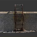 Concrete Block Structure With Rusted Metal Ladder And Surrounding Small Stones