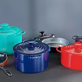 Colorful Cookware Set Including Various Pots Pans With Lids For Modern Kitchen Cooking