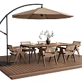 Outdoor Table with Chairs and Patio Umbrella on Wooden Deck with Decorative Branch
