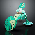 Vibrant Green Decorative Ornament With Large Tropical Leaves And Small Figure On Round Base