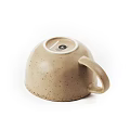 Speckled Beige Ceramic Cup With Handle In Simple Design Isolated On White