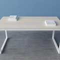 Light Wooden Top Desk With White Frame And Stack Of Books In Blue Wall Room