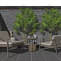 Outdoor Chair Table Set With Stone Wall Bamboo Plants And Black Tiled Floor