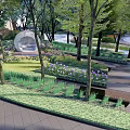 Serene Park Landscape With Lush Trees Round White Pavilion Flower Beds And Benches