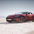 Colorful Sports Cars Parked On Sandy Beach With Mountain Background
