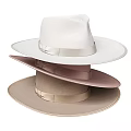 Three Stacked Hats With Different Light Tones And Satin Ribbons
