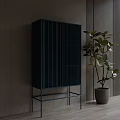 Blue Console Cabinet With Vertical Slat Design And Green Plant In Indoor Entryway