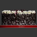 Delicious Chocolate Cake Topped With Whipped Cream Fresh Cherries And Chocolate Shavings On Red Plate