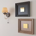 Black And Brown Wall Frames With Decorative Design And Wall Lamp