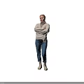 Woman Standing With Crossed Arms In Beige Sweater And Blue Jeans Against Grey Background