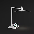 White Wind Turbine with Three Blades Standing Against Black Background for Renewable Energy