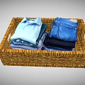Wicker Home Organization Basket With Neatly Folded Shirts Jeans And Clothes