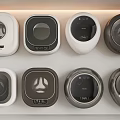 Various Stylish Washing Machines Displayed On Shelf With Different Colors And Designs