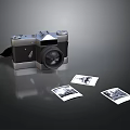 Vintage Electronic Camera With Printed Photos On Black Reflective Surface